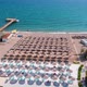 Flight Over the Beach with Umbrellas Towards the Pool in a Luxury Hotel - VideoHive Item for Sale