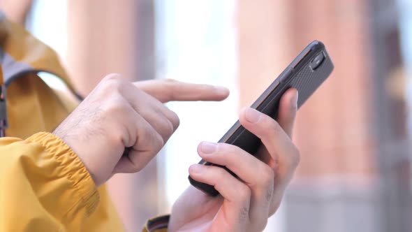 Man Browsing Internet on Smartphone