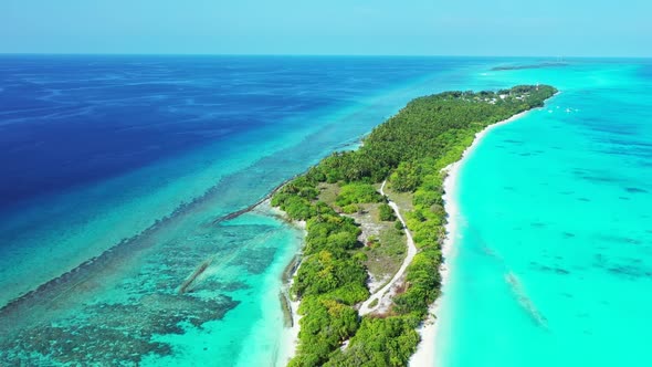 Aerial drone view landscape of relaxing shore beach vacation by blue ocean with white sandy backgrou