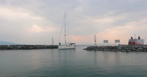 Sailor on the white yacht entering marina