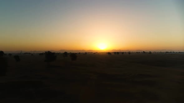 Aerial view of scenic sunset on desert landscape, U.A.E.
