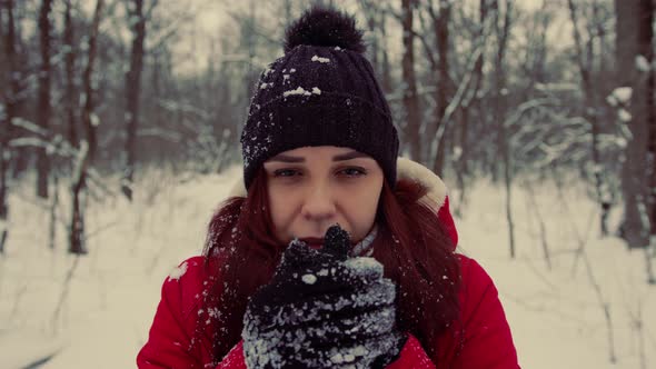 Young Frozen Woman in in the Header and Red Jacket