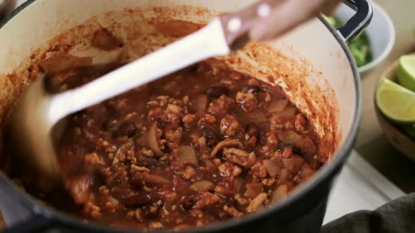 Cooking homemade turkey chili for dinner