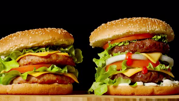 The Concept of American Fast Food. Juicy American Burger with Two Beef Cutlets, with Sauce