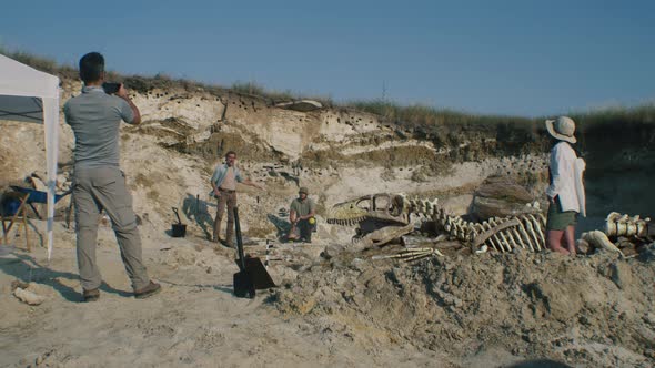 Archaeologists Working on Digging Site