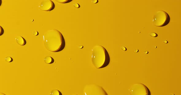 Abstract water drops on yellow background, macro, Bubbles close up