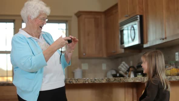 Great grandmother in kitchen with young girl