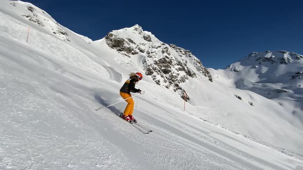 Slow Motion Video Sporty Woman Skiing in Short Turns