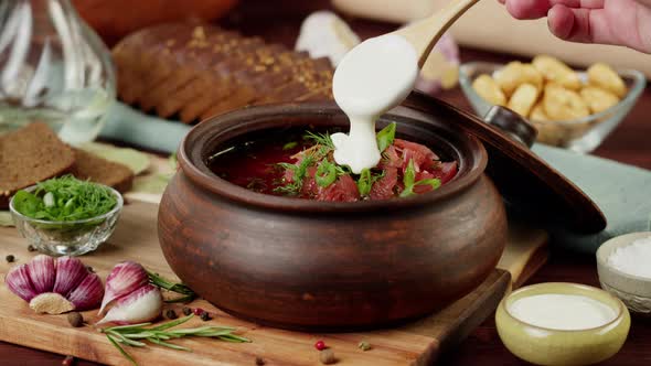 Boiled Borsch with Dill and Parsley Closeup Cooking Soup Made of Beetroot