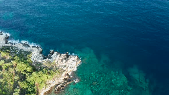 Drone Flying Over the Coast Line with Beautiful Sea Water