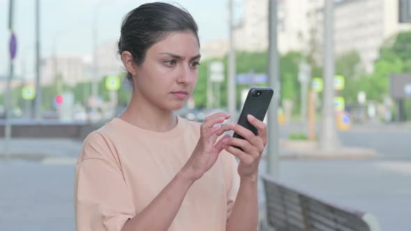 Upset Indian Woman Reacting to Loss on Smartphone