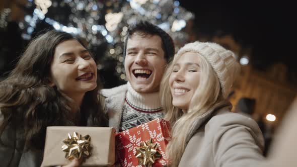 Happy Multicultural Friends Taking Selfie at Xmas Party