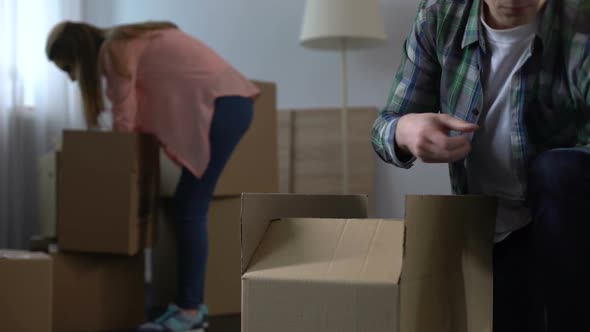 Family Couple Packing and Removing Their Stuff Before Apartment Overhaul