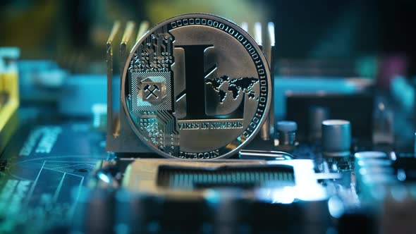 Silver Litecoin displayed on Computer motherboard, Trading and mining Crypto currency