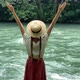Young beautiful vintage woman in straw boater hat raising hands up near mountain river travel nature - VideoHive Item for Sale