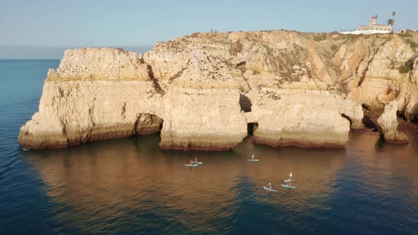 Paddleboarders Practicing Sup Surfing at Ponta De Piedade Portugal Lagos