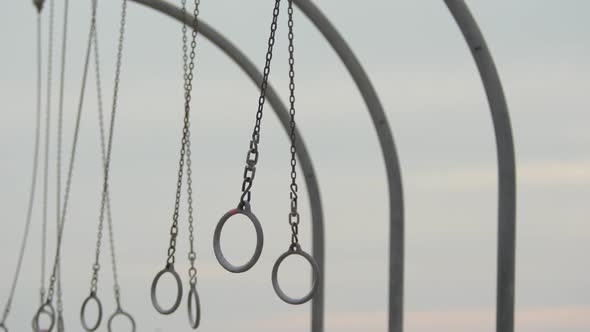 The Santa Monica traveling rings swinging freely in the air.