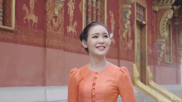 Beautiful Girl In Lao Traditional Dress Costume Walking Near Temple