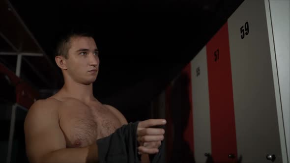 Athletic Guy Changes Clothes in the Locker Room