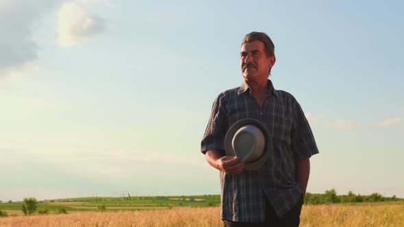 Senior Male Brazilian Farmer Takes His Hat Off