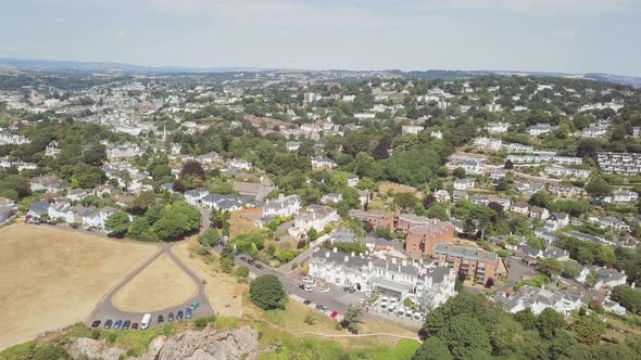 Aerial view of coastal town Torquay in southwest England. A lot of homes, resorts, and hotels are vi