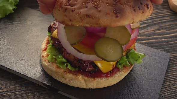 Top View of the Grilled Sesame Bun is Placed on a Fresh Homemade Grilled Burger