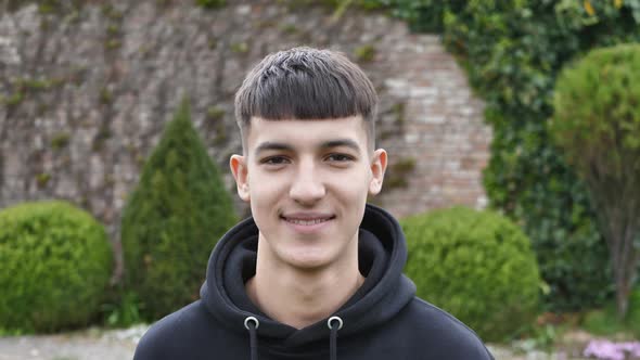 Portrait of a Handsome Young Man Looking at the Camera