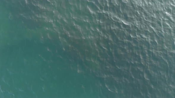 The Camera Shoots Up. Top-down View of the Sea Waves. Sea Ripples. Aerial View. The Background of