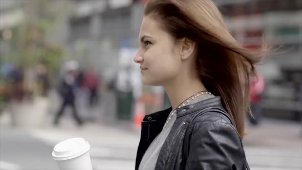 Beautiful Young Caucasian Female Commuting in the City