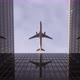 Airplane Flies In Cloudy Weather Over Skyscrapers - VideoHive Item for Sale
