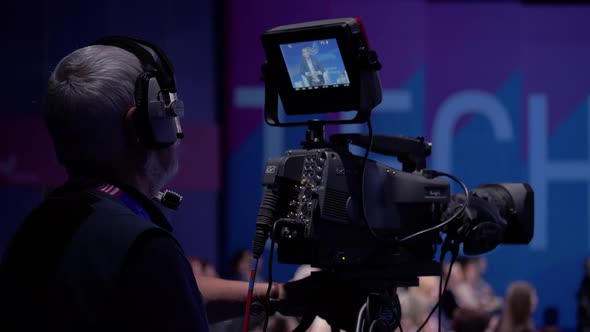 Videographer Working on Political Press Conference