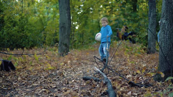 Little Boy is Trying to Tear a Big Branch 2