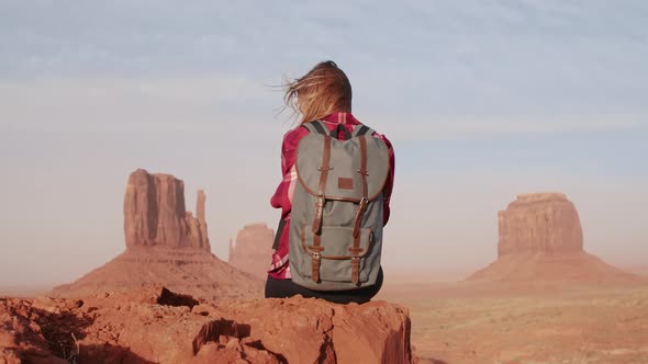 Woman Lifting Arms Up Feeling Freedom and Happiness in Monument Valley  Travel