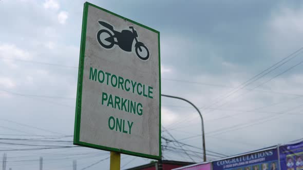 Motorcycle parking only signage alongside the street