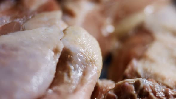 Macro View of a Box Full of Frozen Chicken Legs