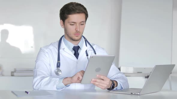 Young Doctor Using Tablet Computer