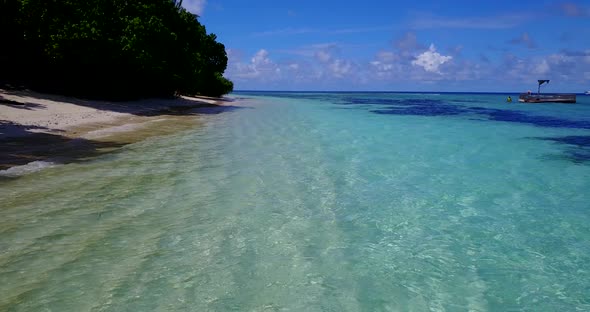 Beautiful overhead abstract shot of a white sand paradise beach and blue sea background 