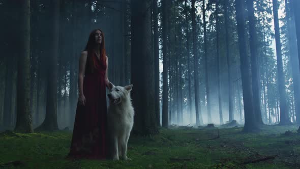 Girl with a dog in a forest