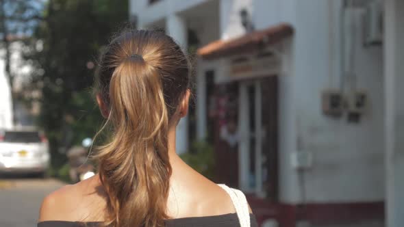 Tanned Woman Enjoys Tour Approaching Souvenir Shop