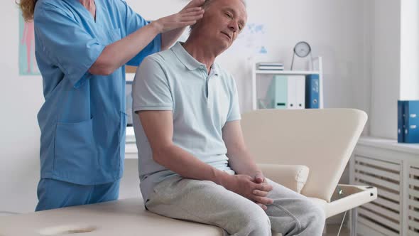 Aged Man Having Rehab Therapy