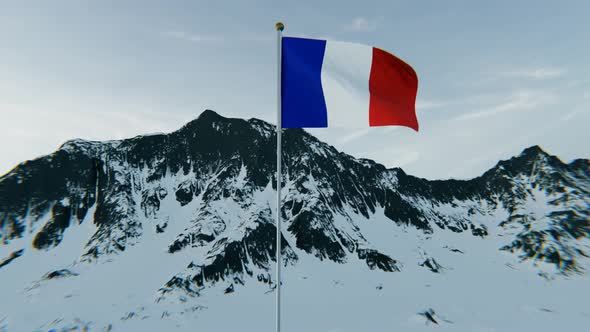 France flag above the snowy mountains. 4K Aerial View