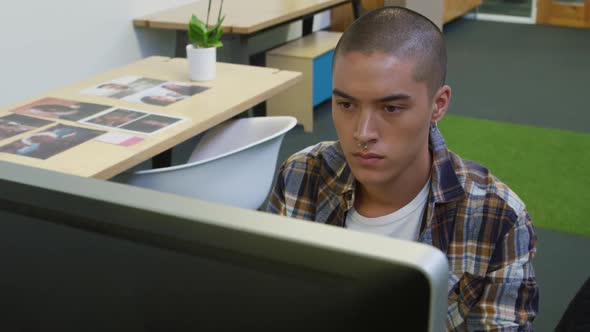 Young man working in a creative office