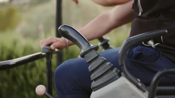 Worker is Operating an Excavator in the Countryside