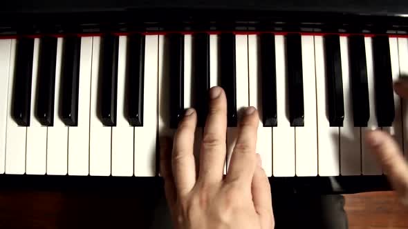 Pianist Hands playing a Grand Piano.