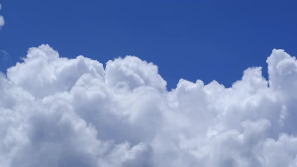 Fluffy cloud time lapse on a cloudy day 4k footage.