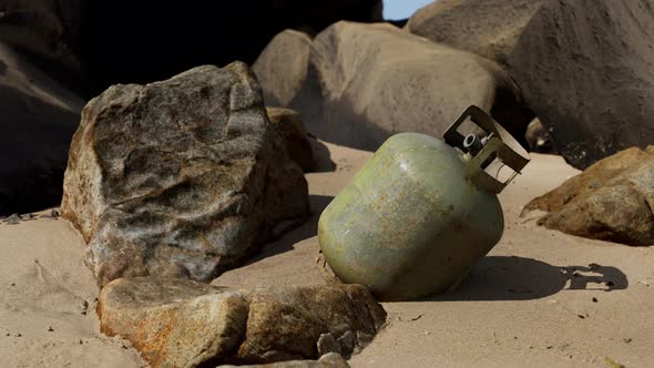 Old Cooking Gas Cylinder on Sand Beach