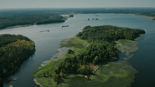 Cargo Ship Moving Between the Islands