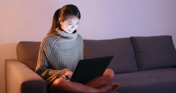 Woman use of laptop computer at home