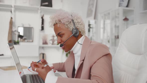 African American Business Woman Wearing Headset Call with Client