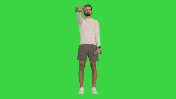 Man Working Out Training His Shoulders on a Green Screen Chroma Key